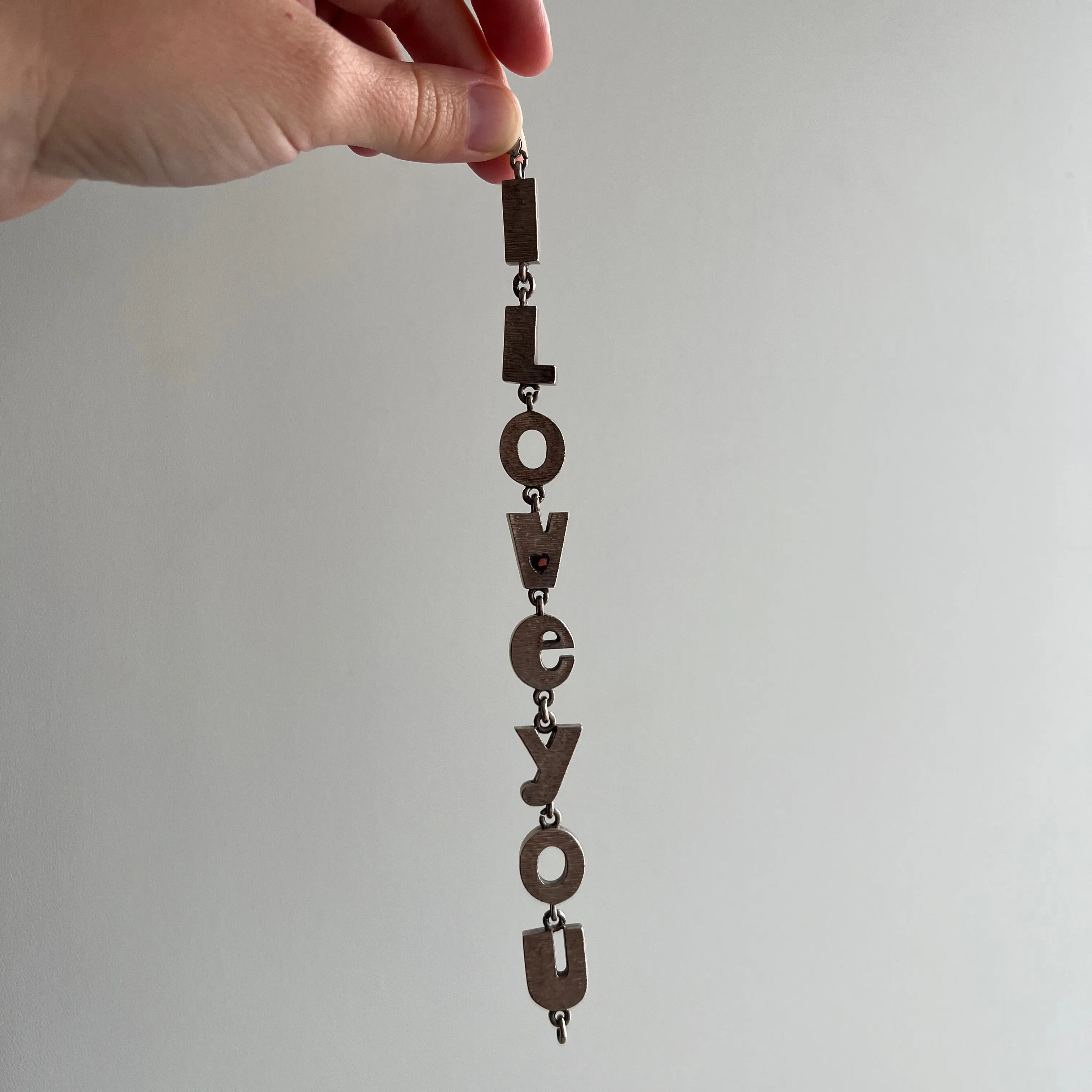 V I N T A G E // I LOVE YOU / sterling silver link bracelet with a garnet heart / 7.75